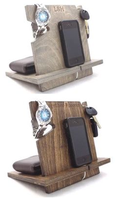 two cell phones are attached to a wooden stand