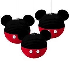 three black and red mickey mouse ears hanging from strings