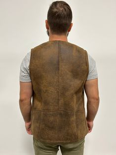 Perfect for three seasons, with the choice to layer on cooler days. Our sheepskin vest are durable, stylish and 100% natural allowing for your body to regulate warm in a productive way. Do you hate how body heat feels from polyester or synthetic fabrics? Then natural sheepskin and wool is the right choice for you. Our vest are made from Merino shearling sheepskin that hasn’t been treated with chemicals that are harmful to the skin. _____ Leather Winter Outdoor Vest, Fitted Sleeveless Rugged Outerwear, Rugged Leather Vest Outerwear, Fitted Leather Winter Vest, Fitted Leather Vest For Winter, Fall Sheepskin Sleeveless Vest, Rugged Brown Vest Outerwear, Sleeveless Sheepskin Vest For Fall, Rugged Fitted Vest Outerwear