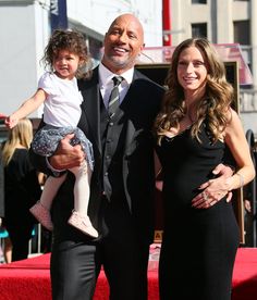 a man and two women standing next to each other in front of a star on the hollywood walk of fame