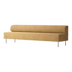 a tan couch sitting on top of a metal frame