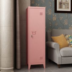 a pink locker next to a couch in a living room