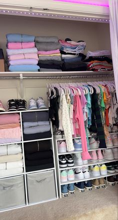 a closet filled with lots of clothes and shoes