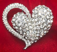 "Vintage Valentine Rhinestone Double Heart Pin Pendant Brooch is a puffy double heart that is completely encrusted with gorgeous, sparkling clear rhinestones in silver tone metal.  This is probably the largest and most spectacular clear rhinestone heart pin pendant brooch we have ever had and the effect is simply spectacular. It measures a generous 2-1/2 x 2-1/2\" and has two large bails on the reverse to keep it in place and allow you to wear it as a pendant as well with your choice of chains, cables, cords and ribbons.    You will be very pleased to wear this all year long as either a brooch or necklace and definitely bring it out for Valentine's Day.  A winner, IMHO, and this one is even better than its picture!   Your beautiful Vintage Rhinestone Heart Pin Pendant Brooch will arrive in Glamorous Crystal Brooch As Gift, Glamorous Crystal Brooches As Gift, Glamorous Crystal Brooches For Gifts, Crystal Brooches With Rhinestones For Anniversary, Heart-shaped Wedding Brooches For Valentine's Day, Glamorous Bling Brooches As A Gift, Glamorous Bling Brooches As Gift, Silver Heart Brooch For Valentine's Day, Silver Heart-shaped Brooch For Valentine's Day