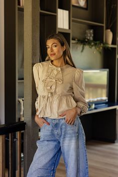 This girly stripe blouse features functional ties that fully open, a peplum silhouette, and balloon sleeves. We love this fun and flirty blouse for all those special occasions. functional ties unlined // paired with the free people good luck mid rise barrel jeans in lightblue Barrel Jeans, Stripe Blouse, Tie Blouse, Blouse Pattern, Balloon Sleeves, Striped Blouse, Memory Lane, Good Luck, Mid Rise