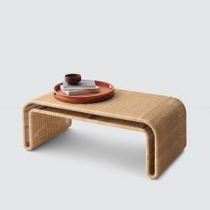 a coffee table with a wooden tray on top