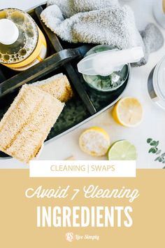 a tray filled with cleaning ingredients on top of a white table cloth next to lemons and