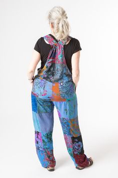 These perfect upcycled overalls are here to bring smiles to you and everyone around you. They will also bring colorful smiles to your closet, we promise. Whether you style them with sandals or rock them with cowboy boots these overalls can do it all. We call them the "hippy" overalls not just because they are a nod to hippie fashion and tie dye overalls of the past, but because of the two sets of coconut buttons on the waist that allow you to adjust the width to maximize your hippy-ness. Did we Spring Multicolor Patchwork Jumpsuits And Rompers, Bohemian Patchwork Overalls For Spring, Playful Blue Summer Overalls, Bohemian Blue Overalls For Summer, Festival Patchwork Overalls, Casual Festival Overalls With Patchwork, Summer Festival Cotton Overalls, Casual Patchwork Overalls For Festival, Casual Patchwork Jumpsuits And Rompers For Festival