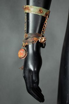 A simple and stylish bracelet, consisting of two pieces connected with chains: a leather string and an upcycled army strap. This jewelry piece is made by hand, from recycled materials. It has a nice rusty finish and dangling charms with a bottlecap and a leather tassel. It's a great eye-catching detail that will add a bling to your festival costume! All of our clothes are handmade, which is why individual pieces may slightly differ from those shown in the photos. If you can't find your size or would like to customize this product according to your preferences, please don't hesitate to contact us. MORE APOCALYPTIC CLOTHES AND ACCESSORIES AT: https://www.etsy.com/shop/WastedCouture ------------------------------ Wasted Couture - WastedCouture Wear if you dare! Hand Cast Metal Bohemian Bracelets, Bohemian Hand Cast Metal Bracelets, Punk Style Metal Bracelet Strap Jewelry, Punk Metal Jewelry With Bracelet Strap, Punk Style Metal Bracelet, Adjustable Metal Punk Chain Bracelet, Adjustable Metal Chain Bracelet, Punk Style, Adjustable Brass Chain Bracelets, Adjustable Brass Chain Bracelet