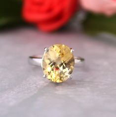 Presenting you a beautiful Adjustable Ring with Yellow/Light Golden Topaz in oval checker cut Shape to sparkle and reflect the light more on facets when you wear and move your finger.  Easy and adjustable Ring so you can wear it daily. The Color Of Topaz Is Pastel Yellow /Light Golden gives you Fresh Vibes every time you wear it. An Adorable Gift for your Loved one as a proposal or anniversary , Birthday Gift Item No: skj. 14.482 Item:Natural Yellow Topaz Cluster Ring In 925 Sterling Silver Primary stone: Yellow Topaz Secondary Stone:--- Article Weight:3.4  gms primary stone Size : 12x10 mm Ring Length:2 cm Ring Width:1.1 cm Maintenance Tips 1.Keep the jewelry away from direct heat, water, perfumes, deodorants, and other strong chemicals.  2.Wipe the Jewellery gently with a chamois cloth o Oval Yellow Topaz Promise Ring, Yellow Oval Topaz Promise Ring, Oval Yellow Citrine Birthstone Ring, Oval Citrine Birthstone Ring, Yellow Topaz Ring With Center Stone In Sterling Silver, Yellow Oval Topaz Rings, Anniversary Yellow Topaz Citrine Ring, Anniversary Yellow Citrine Topaz Ring, Yellow Oval Birthstone Promise Ring