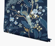 a blue wallpaper with an image of a bird on a tree branch and flowers