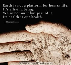 a hand with dirt on it and a quote from thomas moore about earth is not a platform for human life