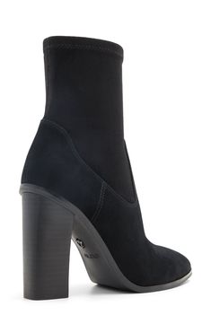 A stretchy shaft adds modern appeal and comfortable wear to a cushioned bootie framed by an almond toe and stacked block heel. 5 1/2" shaft 4" heel Side zip closure Cushioned footbed Leather and textile upper/recycled polyester, textile and synthetic lining/synthetic sole Imported Heeled Boots With 4-inch Block Heel In Medium Width, Heeled Boots With 4-inch Block Heel, Trendy Medium Width Heeled Boots With 4-inch Heel, Boots With 4-inch Block Heel And Medium Width, Trendy Boots With 4-inch Block Heel, Fitted Platform Boots With Padded Block Heel, Sleek Heeled Boots With 4-inch Heel, Fitted Platform Boots With Reinforced Block Heel, Fitted Block Heel Boots With Padded Heel