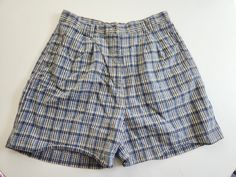 These vintage shorts are perfect for summer days. L.A. Blues Circa 1990s - 2000s 55% ramie / 45% cotton Made in Hong Kong The shorts feature a blue plaid pattern. There are belt loops, a zipper fly, and three pockets. Tag size: 16 Total length: 18.75 inches Waist: 32 inches Hips: up to 47 inches Inseam: 5.25 inches These shorts are in good vintage condition with minor wear. Feel free to send me any questions! 90s Style Bottoms With Built-in Shorts, Vintage Summer Shorts With Pockets, 90s Style Cotton Summer Pants, 90s Style Shorts With Pockets For Summer, 90s Style Bottoms With Pockets For Summer, 90s Style Summer Shorts With Pockets, 90s Summer Bottoms With Pockets, 90s High Waist Pants For Summer, 90s High Waist Summer Pants