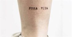 a woman's leg with the word pura vida written on it