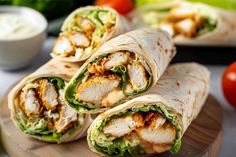 chicken and lettuce wraps on a cutting board