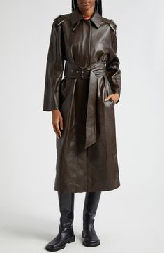 The timeless trench coat goes in for an elevated remix with a faux-leather option that boasts all the supple swagger of the real deal. 47" length (size Medium) Hidden-snap placket Spread collar Side-seam pockets Epaulets Storm flap Removable belt Lined 100% recycled polyester with polyurethane coating Dry clean Imported Fall Leather Belted Outerwear, Belted Faux Leather Outerwear For Work, Faux Leather Belted Outerwear For Work, Winter Workwear Belted Leather Jacket, Fall Business Leather Jacket With Belt, Belted Leather Jacket For Business In Fall, Luxury Faux Leather Outerwear For Fall, Luxury Faux Leather Outerwear For Work, Sleek Belted Leather Jacket For Fall