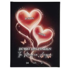 two heart shaped balloons in the shape of hearts on a black background with text that reads,