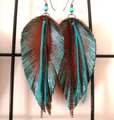 Turquoise Handmade Tassel Earrings For Festivals, Handmade Turquoise Tassel Earrings For Festival, Brown Bohemian Hand Painted Earrings, Bohemian Brown Hand Painted Earrings, Bohemian Hand Painted Brown Earrings, Handmade Brown Tassel Earrings, Brown Dangle Earrings With Artsy Style, Trendy Fringe Earrings As A Gift, Handmade Tassel Earrings For Festivals