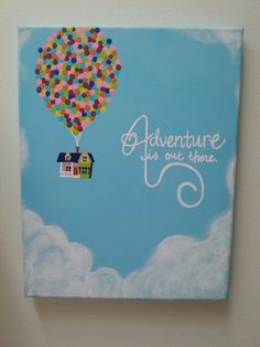 there is a painting on the wall that says adventure is out there with a hot air balloon