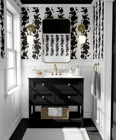 a black and white bathroom with gold accents