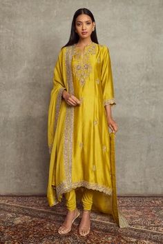 Mustard kurta with floral embroidery and scallop border. Paired with churidar and embroidered border dupatta.
Component: 3
Pattern: Embroidered
Type Of Work: Floral
Neckline: Notched
Sleeve Type: Long Sleeves
Fabric: Cheniya Silk
Color: Yellow
Other Details: 
Floral motifs
Embroidered border dupatta
Occasion: Wedding, Bride - Aza Fashions Jayanti Reddy, Trouser Pattern, Garden Embroidery, Zardozi Embroidery, Kurta Set For Women, Women Kurta, Orange Ombre, Embroidered Pants, Tarun Tahiliani