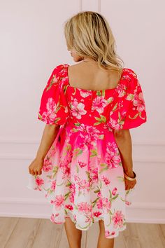 - Add a perfect pop of petals with this cutie! - Fully lined breezy material with a green and pink hued floral print - A v-cut neckline with a hidden snap for additional closure - Back zip closure - Short puff sleeves with elastic cuffs - A flowy and flattering silhouette that ends in a mini dress length hemline Pink Hibiscus Print Dresses For Spring, Pink Hibiscus Print Summer Dress, Pink Hibiscus Print Spring Dresses, Pink Floral Printed Mini Dress, Pink Printed Mini Floral Dress, Spring Dresses With Hibiscus Print And Short Sleeves, Pink Square Neck Floral Dress For Spring, Pink Hibiscus Print Dress For Vacation, Pink Hibiscus Print Vacation Dress