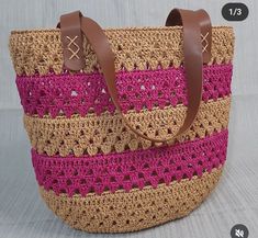 a crocheted bag is shown with leather handles