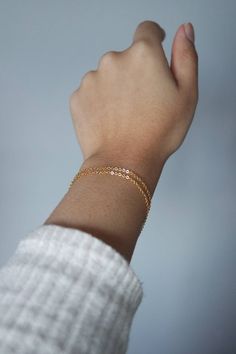 This gold filled bracelet is perfect for everyday stacking bracelet or wear it alone for a minimalist look! Choose your style from 1 or 2 stands! - Chain - 18k gold filled chain -  With 1 inch extender We do NOT accept returns or exchanges for these bracelets. Please shop carefully. If you have any questions about the length/fit, please don't hesitate to contact us! MEASURING YOUR WRIST - FIND THE PERFECT FIT! If you have a seamstress tape measure, wrap it around your wrist to a comfortable fit. If you don't have a seamstress tape measure, take a piece of yarn or string and wrap that around your wrist to a comfortable fit, marking the point where the end touches itself. Lay the string straight next to a ruler and note the length. All of our bracelets have 1-inch extender chains so most cus Dainty Yellow Gold Chain Bracelet For Layering, Minimalist Yellow Gold Chain Bracelet For Layering, Delicate Stackable Chain Bracelet, Minimalist Yellow Gold Bracelets For Layering, Layering Bracelets With Delicate Chain, Minimalist Stackable Chain Bracelet For Layering, Dainty Delicate Chain Bracelets For Layering, Dainty 14k Gold-filled Cable Chain Bracelet, Dainty Hypoallergenic Bracelets For Layering