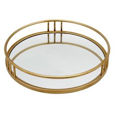 a round glass tray with gold metal frame