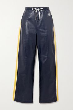 Loewe’s track pants are made from butter-soft leather and topped with a comfortable drawstring waistband. They're detailed with yellow stripes running along the sides and the label's logo at the hip. Style yours with a classic tank and the matching jacket. Twink Fashion, Loewe Jeans, Loewe Fashion, Game Day Fits, Comfy Sets, Hip Style, Louis Vuitton Fashion, Denim Pants Women, Fashion Me