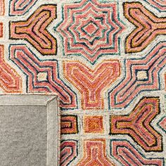 an area rug with various colors and patterns on it