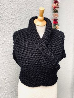 Hand knitted Outlander inspired shawl in black color. - triangle design, can be worn in many different ways - a small button can be attached to one of the tips, so you can secure it in the back for cross body style (if you desire a button, please include you request in a message to the seller at the check out) - super soft 90% acrylic, 10% sheep wool yarn - available in any color or yarn imaginable, please contact me for custom orders -made in smoke and pet free environment The wing span is appr Outlander Sweater Wrap, Outlander Crochet Highlander Shawl Size, Outlander Scarf, Outlander Cowl, Outlander Shawl, Claire's Shawl Outlander, Outlander Gifts, Super Scarf, Button Scarf