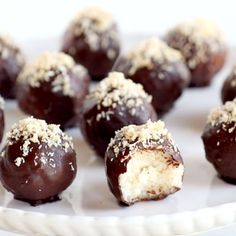 chocolate covered desserts are on a white plate