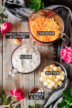 ingredients to make cheddar and garlic bread laid out on a wooden table with flowers