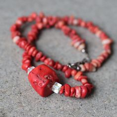 Vintage Natural Red Coral Necklace With Cut Aurora Borealis Crystal Beads. Great Piece With A Deep Red Color. This Is The Color That This Coral Has In Nature And It Is Not Dyed Therefore There Are Some Variations In The Beads Coloring And Texture. Beautiful Iridescent Cut Crystal Bead Accent. The Decorated Silver Hook And Eye Closure Is A Nice Touch. -Raw Coral -Silver Closure -Made In The 1960s Measurements: 18" Mentionable Imperfections: None Stock #: 0000 Red Rondelle Jewelry With Faceted Beads, Red Rondelle Beads Jewelry With Faceted Detail, Faceted Red Coral Beads Jewelry Gift, Red Rondelle Jewelry With Polished Beads, Coral Faceted Beads Jewelry As Gift, Coral Faceted Beads Jewelry For Gifts, Red Gemstone Beaded Necklaces In Rondelle Shape, Elegant Red Beaded Necklace With Lobster Clasp, Red Rondelle Single Strand Beaded Necklace