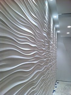 a white wall with wavy lines on it