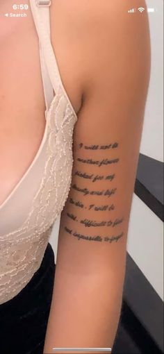 a woman's arm with writing on it and the words written in cursive font