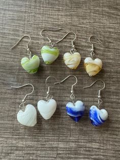 Welcome to my store and if you are looking for a new piece of jewelry for that new outfit, a gift or just something new, you have come to the right store.  Take a look around at all of my lovely pieces and I am sure you will find one that you will like.  🩴This earrings are made with glass hearts and will add flair to any outfit.  ⚠️Note: Colors may vary depending on your monitor  ⚠️ Each pendant is made the same but the design might be slightly different on each one. 🟣I do have other colors fo White Heart Beads Drop Earrings, White Drop Earrings With Heart Beads, White Heart Drop Earrings For Jewelry Making, White Dangle Heart Earrings With Ear Wire, Everyday White Heart Earrings, Heart Beads Drop Earrings For Gift, White Heart-shaped Earrings With Heart Charm, White Heart Pendant Earrings For Valentine's Day, Heart Pendant Earrings With Heart Beads