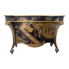 an ornately decorated sideboard with gold trimmings and black paint on it