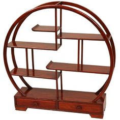 a wooden shelf with three shelves in the shape of a circle on top of it