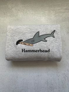 a towel with a shark on it that says hammerhead