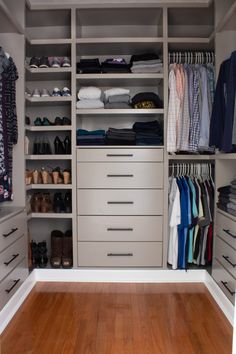 an organized closet with white drawers and lots of clothes on the bottom shelf, along with several pairs of shoes