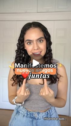 a woman is holding up a sign with the words, manfistemos neves anigos lunaas