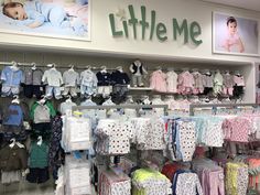 baby clothes are displayed in the store for children's clothing and other things to buy