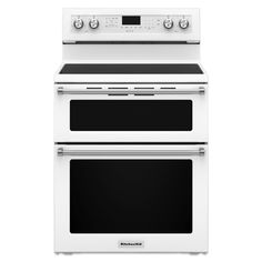 two white ovens side by side against a white background