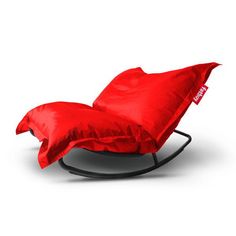 a rocking chair with a red cover on it