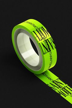 a roll of neon green tape with black writing on it