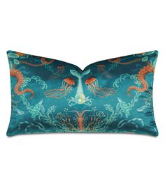 a blue and orange pillow with sea creatures on it