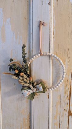 an old door with a wreath hanging on it